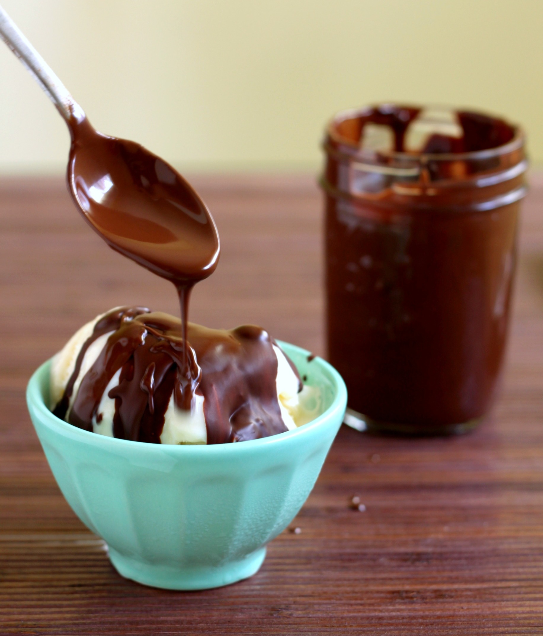 Pouring magic shell chocolate sauce on ice cream 2