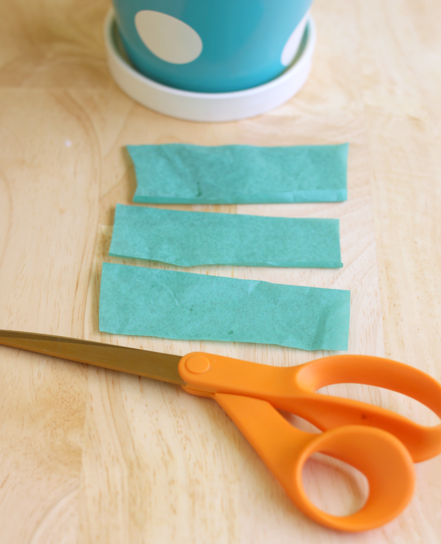 Cut strips of green tissue paper